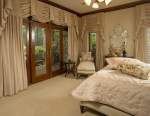 Custom windows with drapes in bedroom