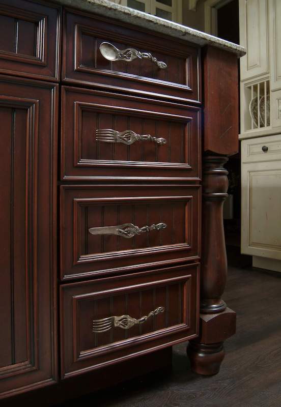 Island drawers with handles in shape of kitchen utensils