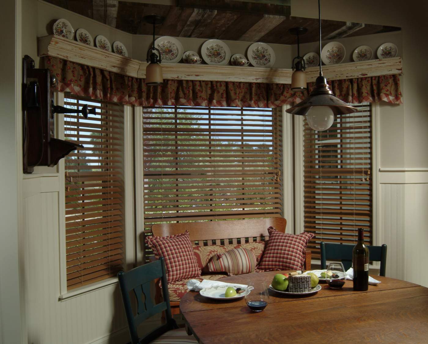 Nook with decorative plates above window