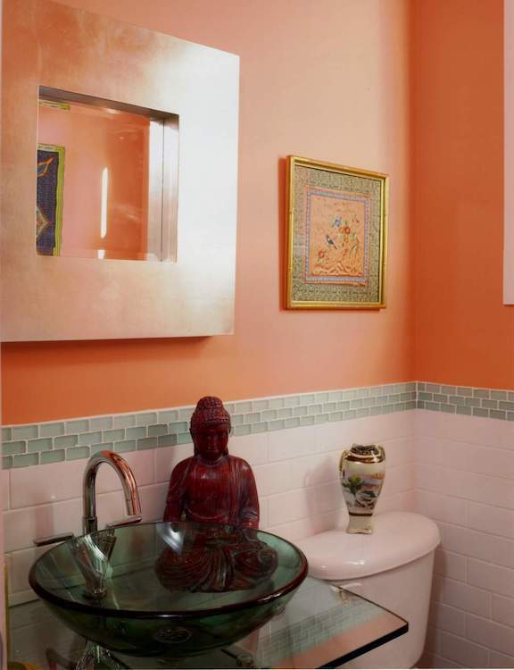 Orange bathroom with bowl sink