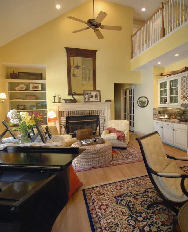 Yellow living room with fireplace